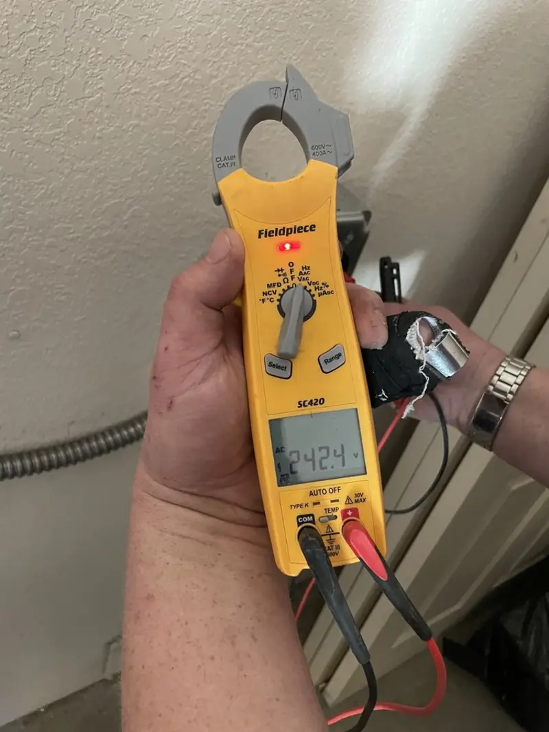 Voltage testing with clamp meter during Electrical Installation Services in Floral City